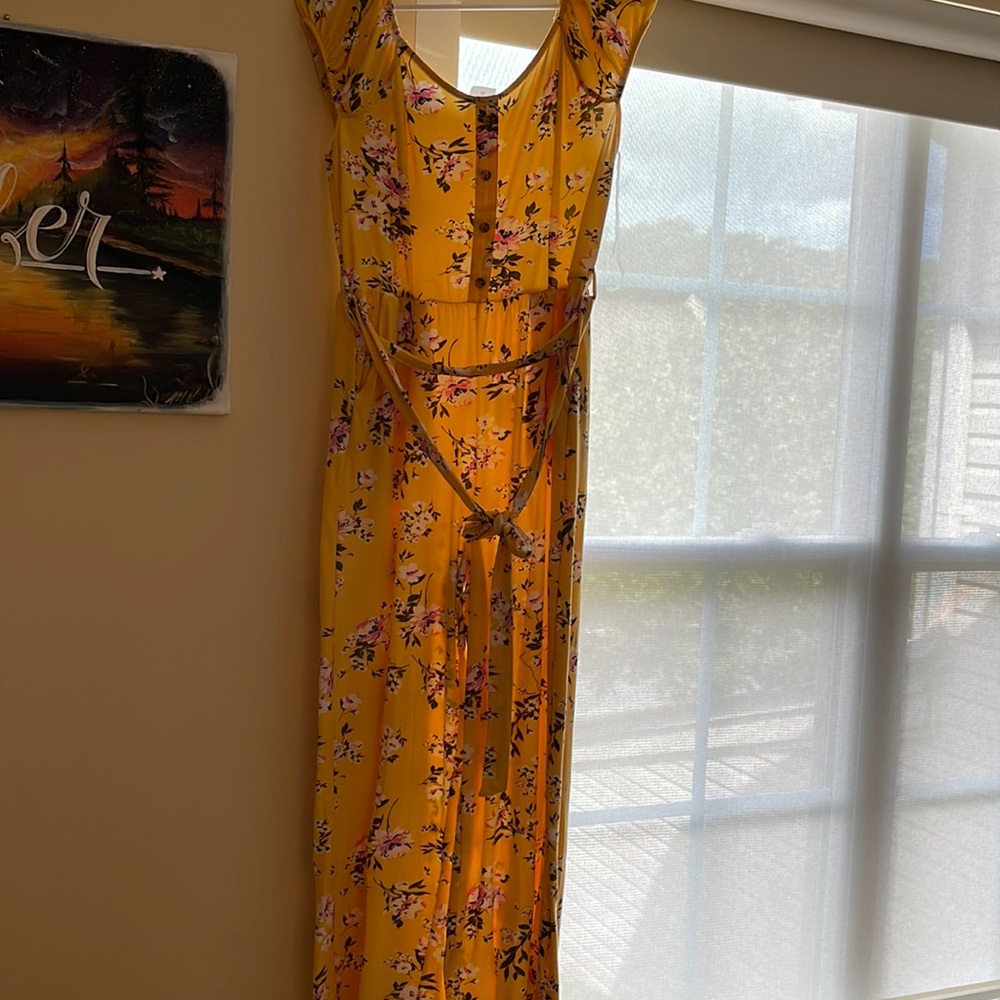 SIZE LARGE Yellow pink and green flowered jumpsuit.Flare bootcut.
